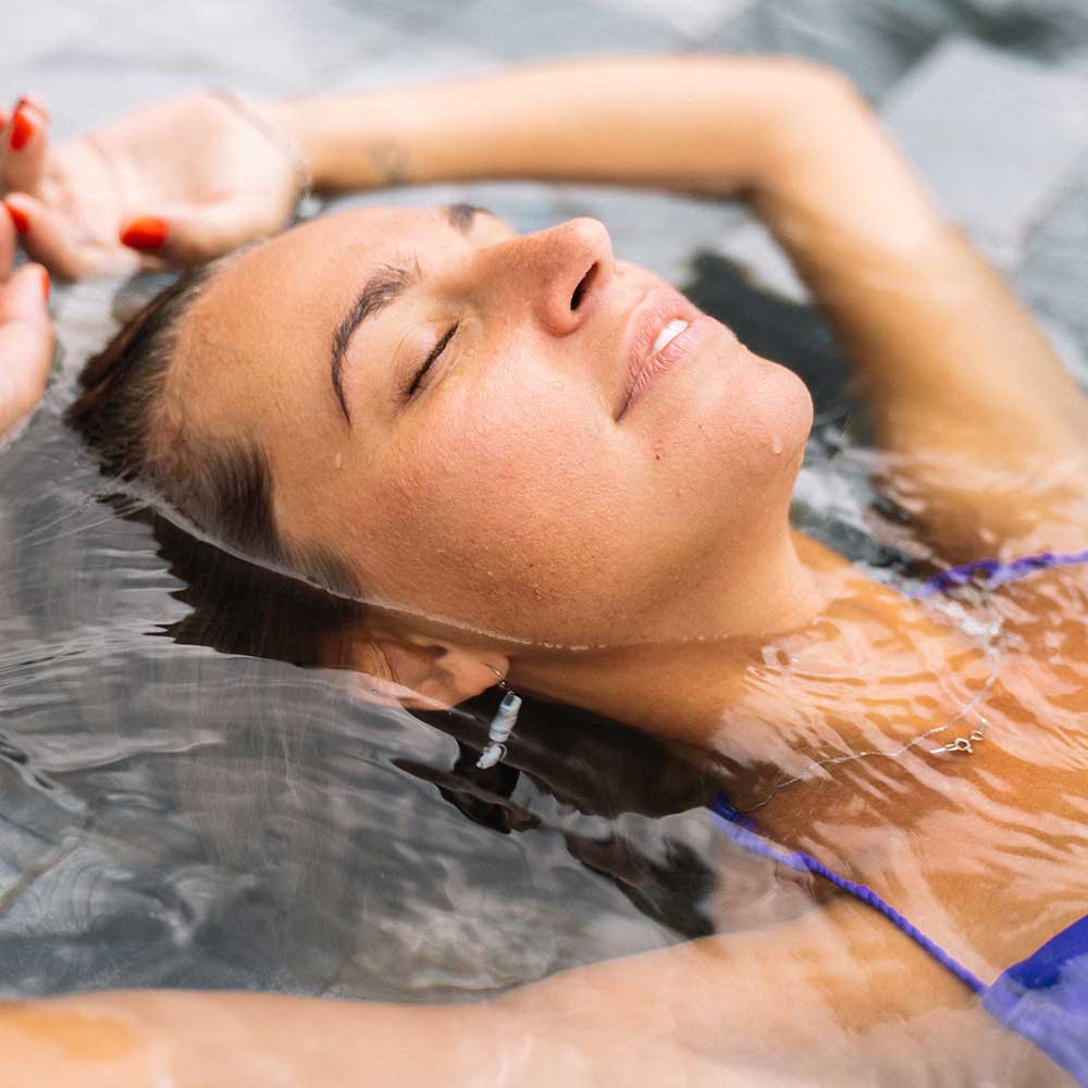 Woman laying in water floating