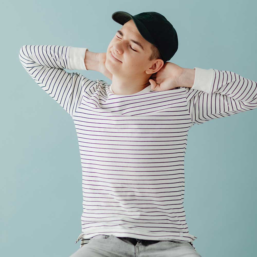 Young man with pain in his neck and back