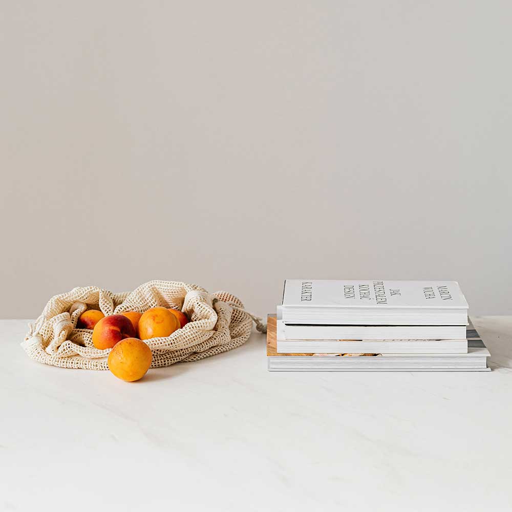 Fruit and health books on a table